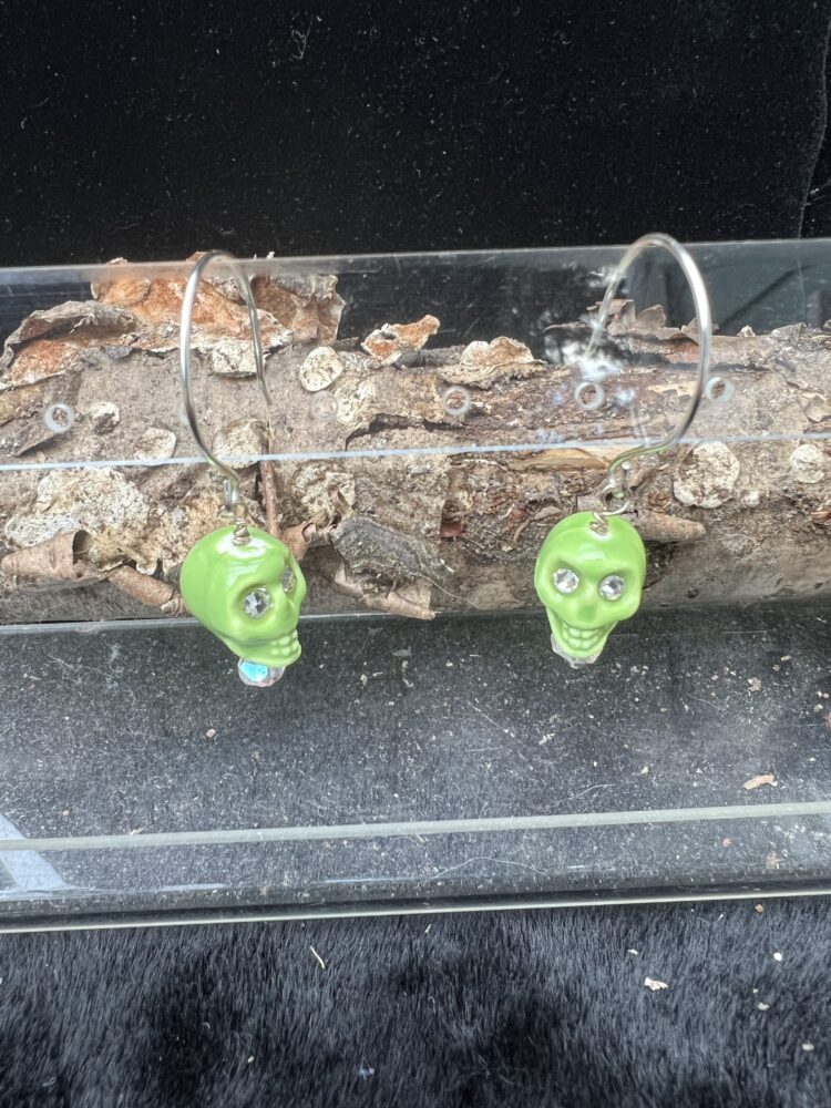 Green glass skull earrings